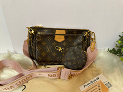 Louis Vuitton monogram crossbody bag with adjustable strap, showcasing the classic LV design in neutral tones.